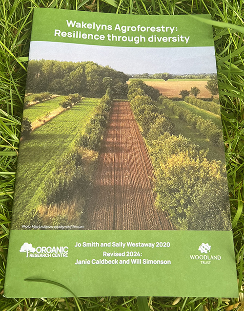 Wakelyns Agroforestry: Resilience through Diversity. Booklet photographed in grass.