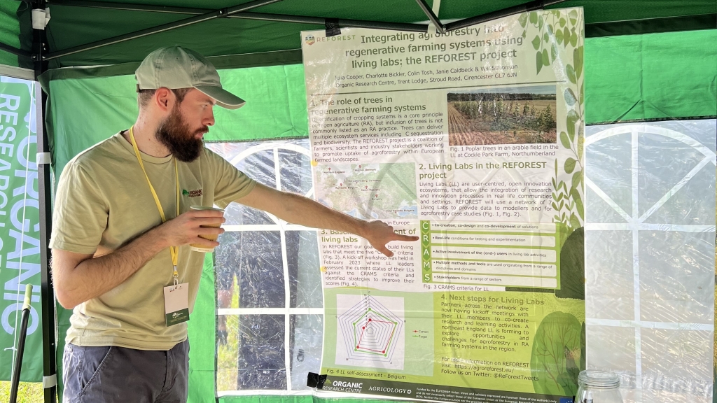 Christian expaining ReForest poster at Agroforestry Show 2023
