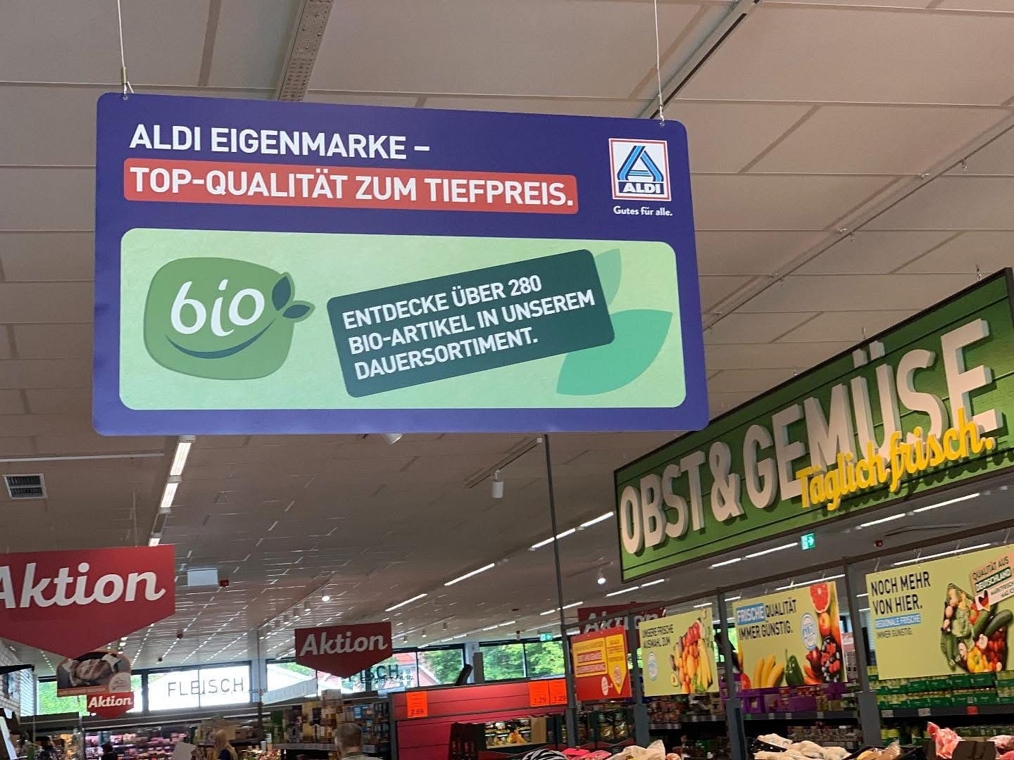 Shows organic promotion board in German supermarket